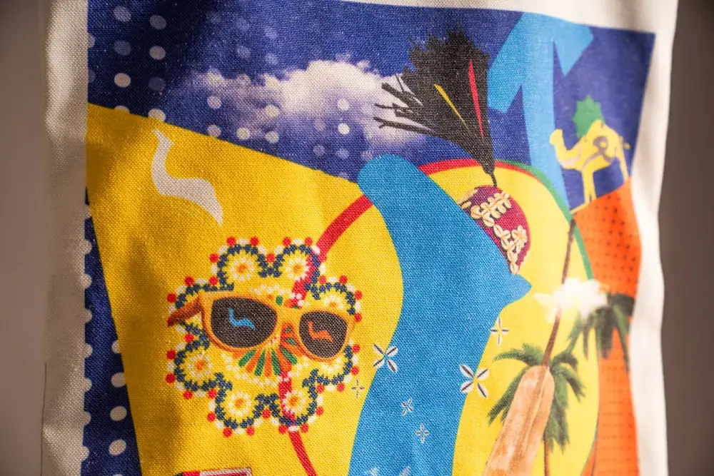 CAMEL artwork applied to printed fabric with visible texture