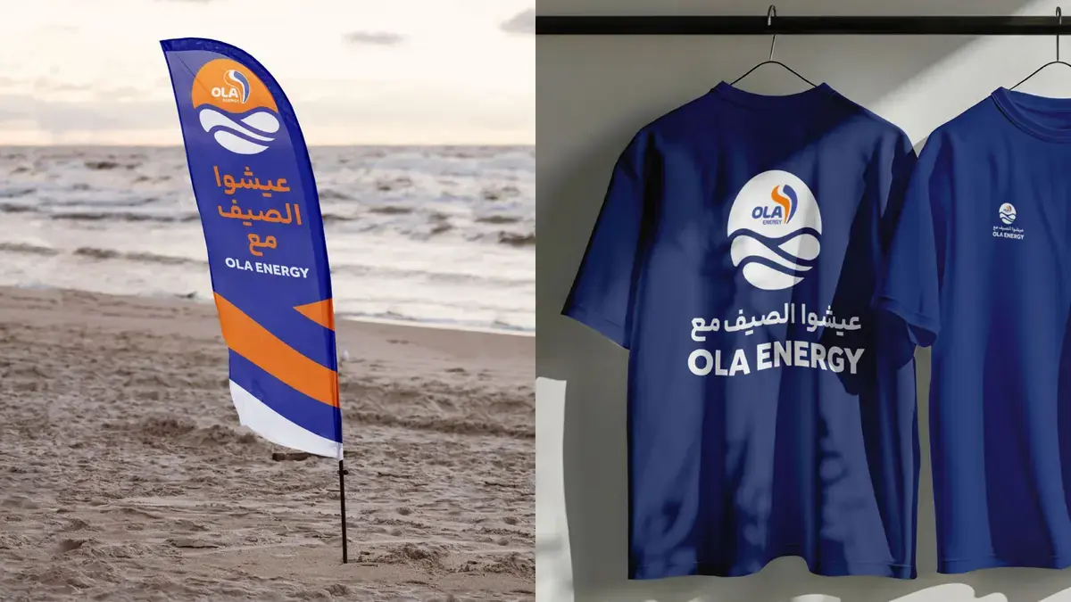 OLA Energy summer beach activation featuring branded flags and team apparel